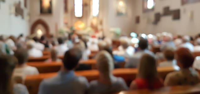 People sitting inside of a church