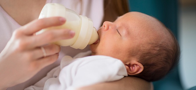 mother-feeding-baby-bottle-newborn-baby